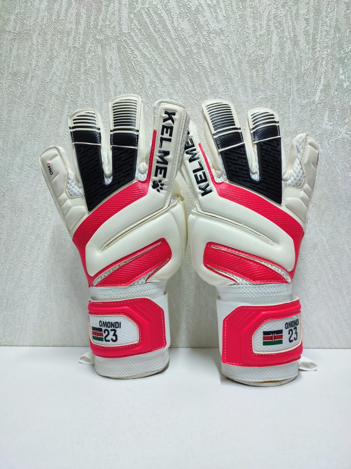 Kelme K-Paw glove strap customized with a name and number