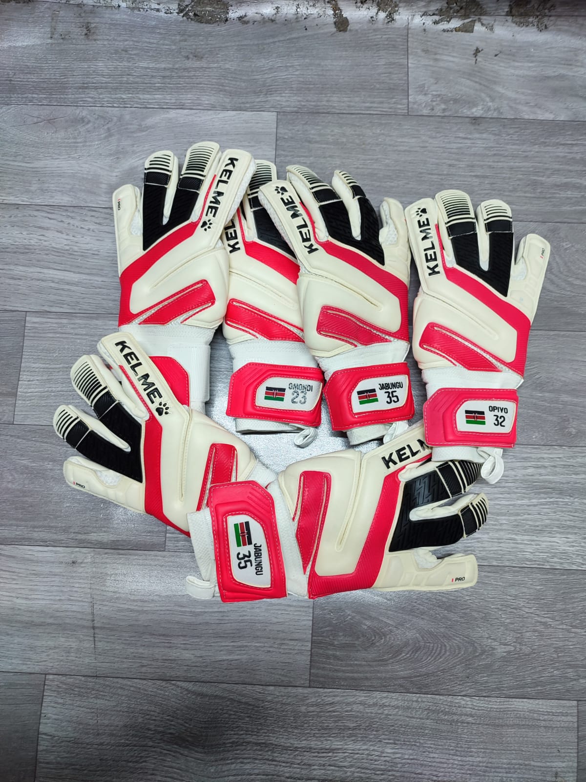 Kelme K-Paw glove strap customized with a name and number