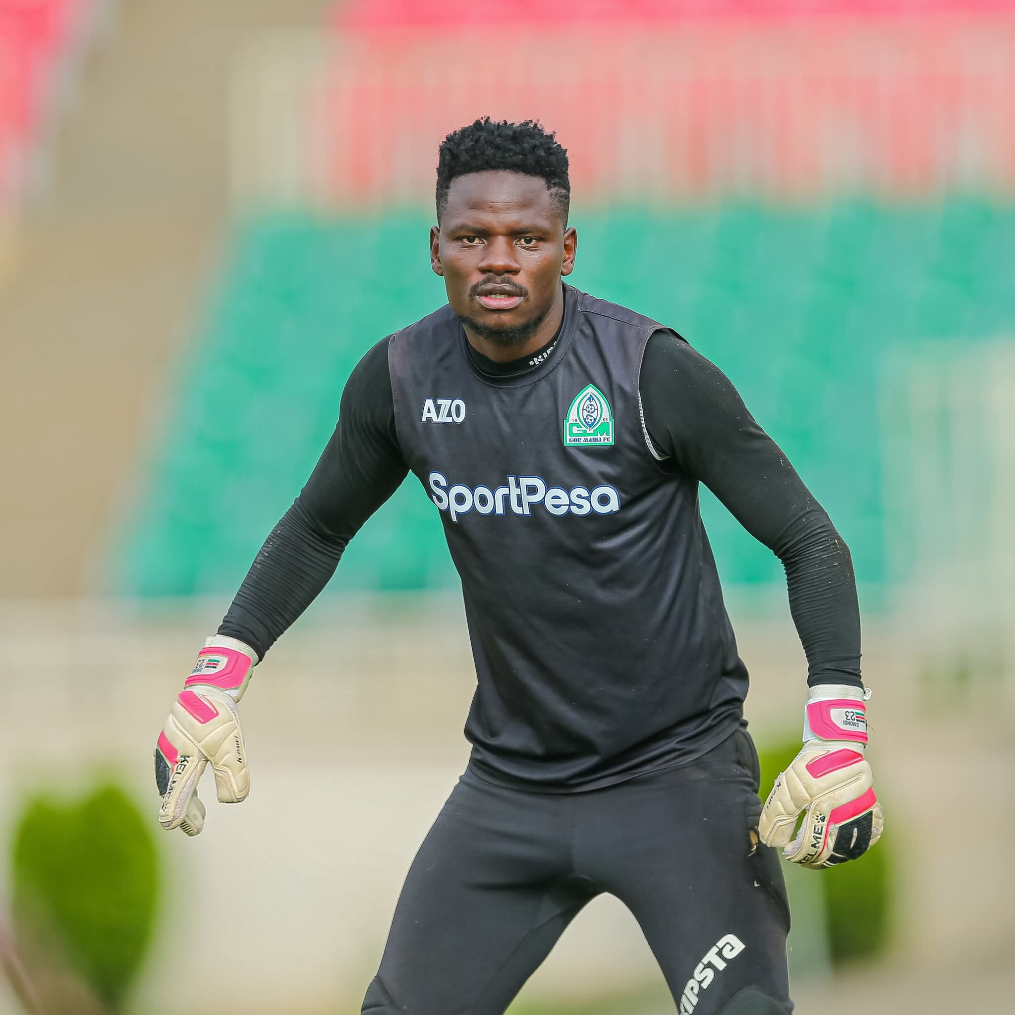 Goalkeeper wearing Adidas Predator Pro gloves