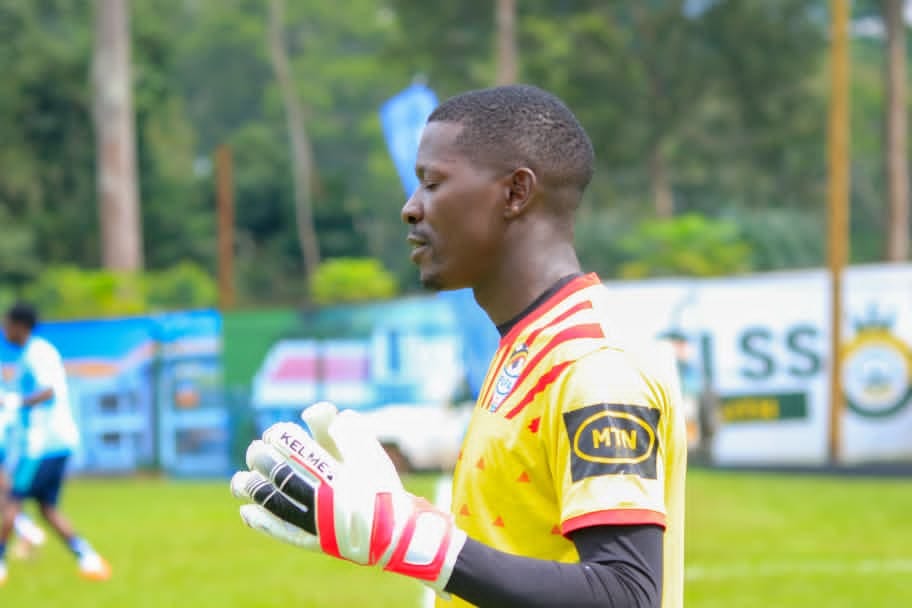 Goalkeeper wearing Adidas Predator Pro gloves