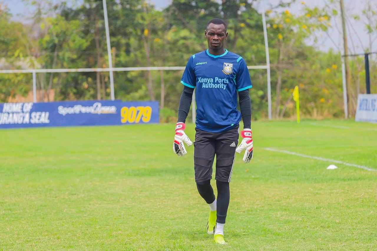 Goalkeeper wearing Adidas Predator Pro gloves