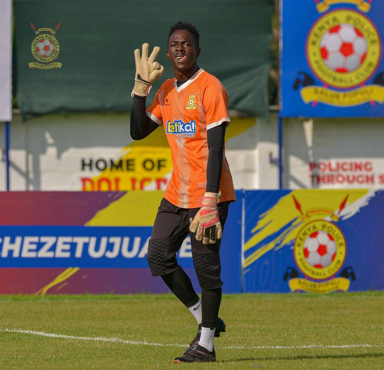 Goalkeeper wearing Adidas Predator Pro gloves
