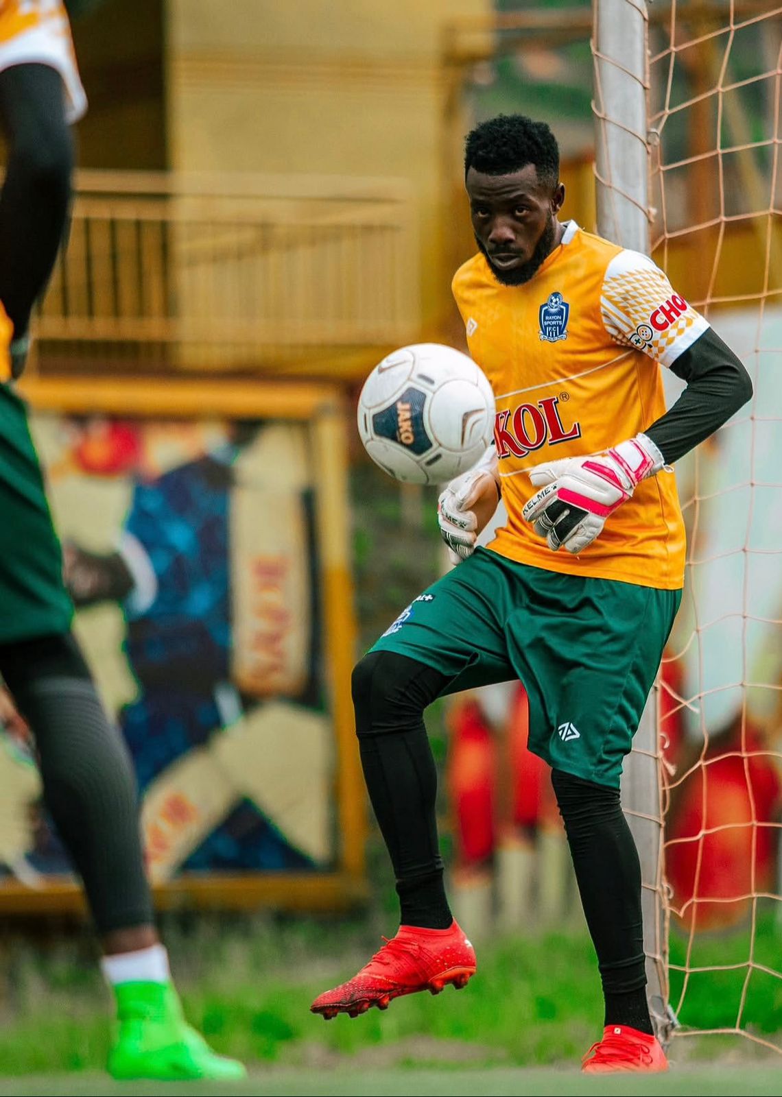 Goalkeeper wearing Adidas Predator Pro gloves